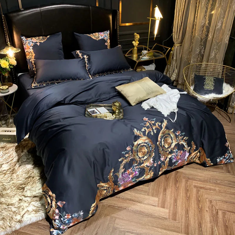 Navy duvet cover with gold and colourful floral embroidery styled in a dark bedroom