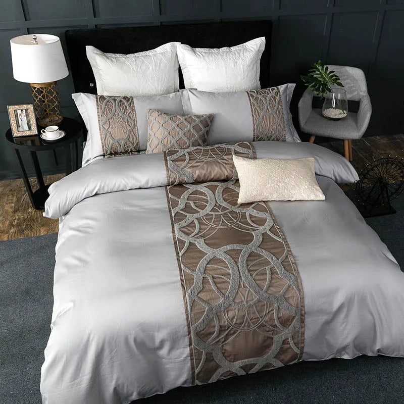 Silver grey duvet cover with a bronze looped thread panel and matching pillowcases