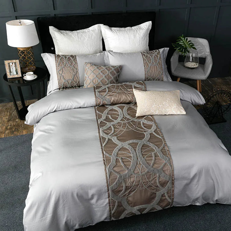 Silver grey duvet cover with a bronze looped thread panel and matching pillowcases