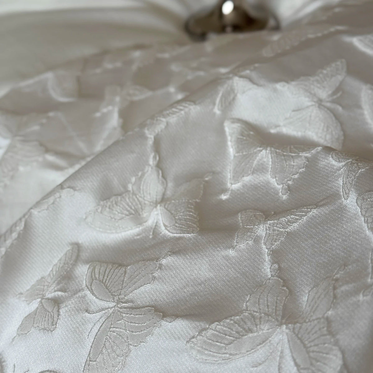 Detail of woven butterflies on the duvet cover