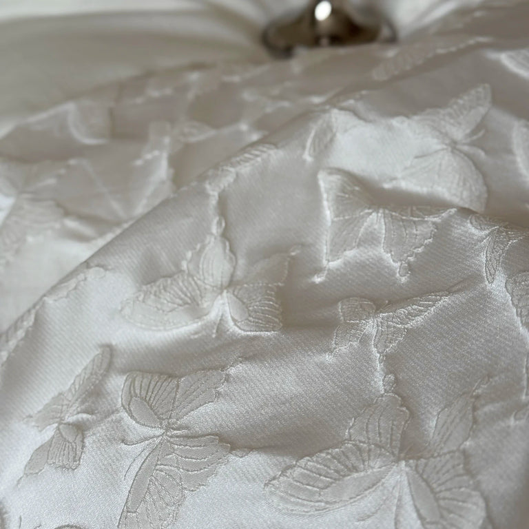 Detail of woven butterflies on the duvet cover
