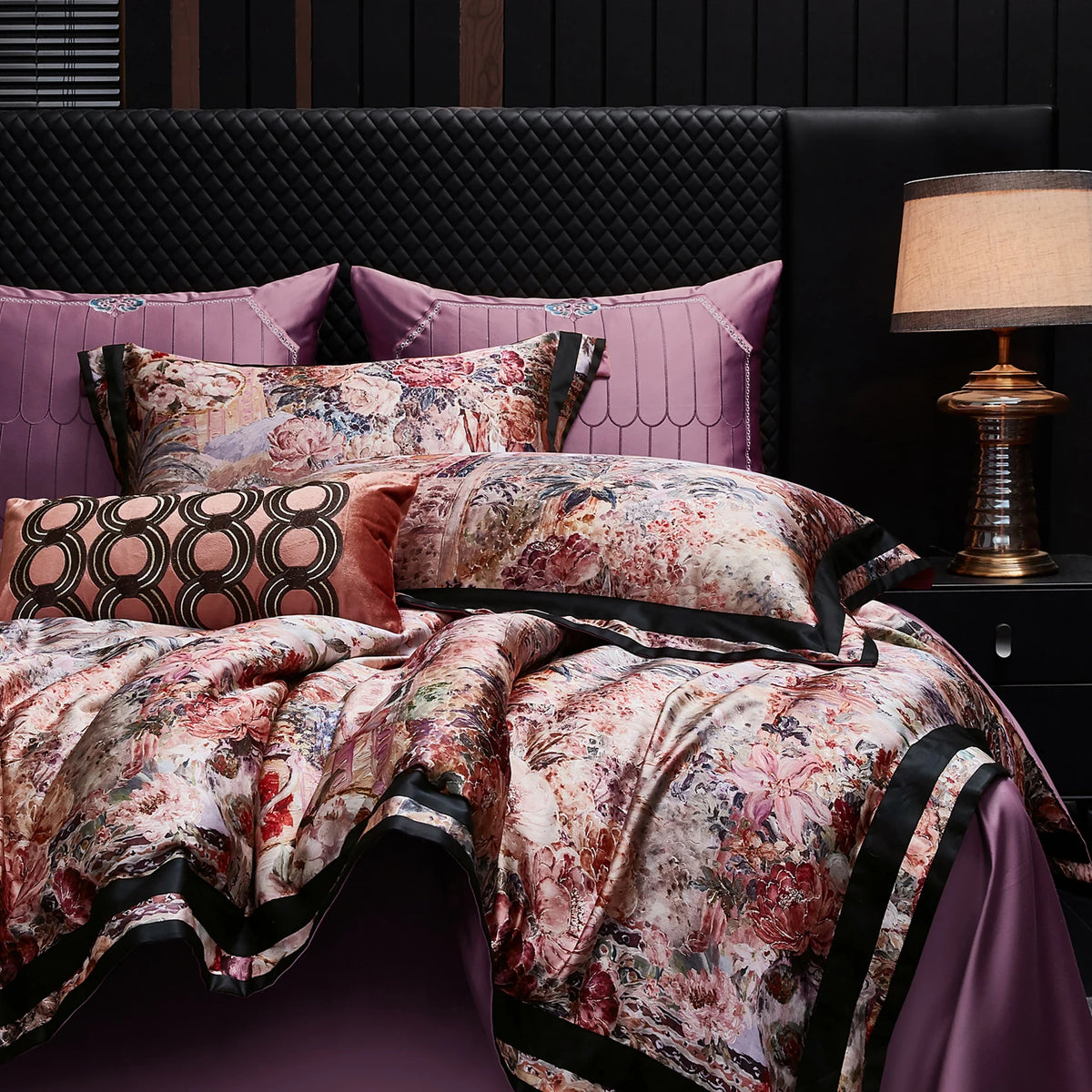 Floral bedding set with plum pillows and a black border