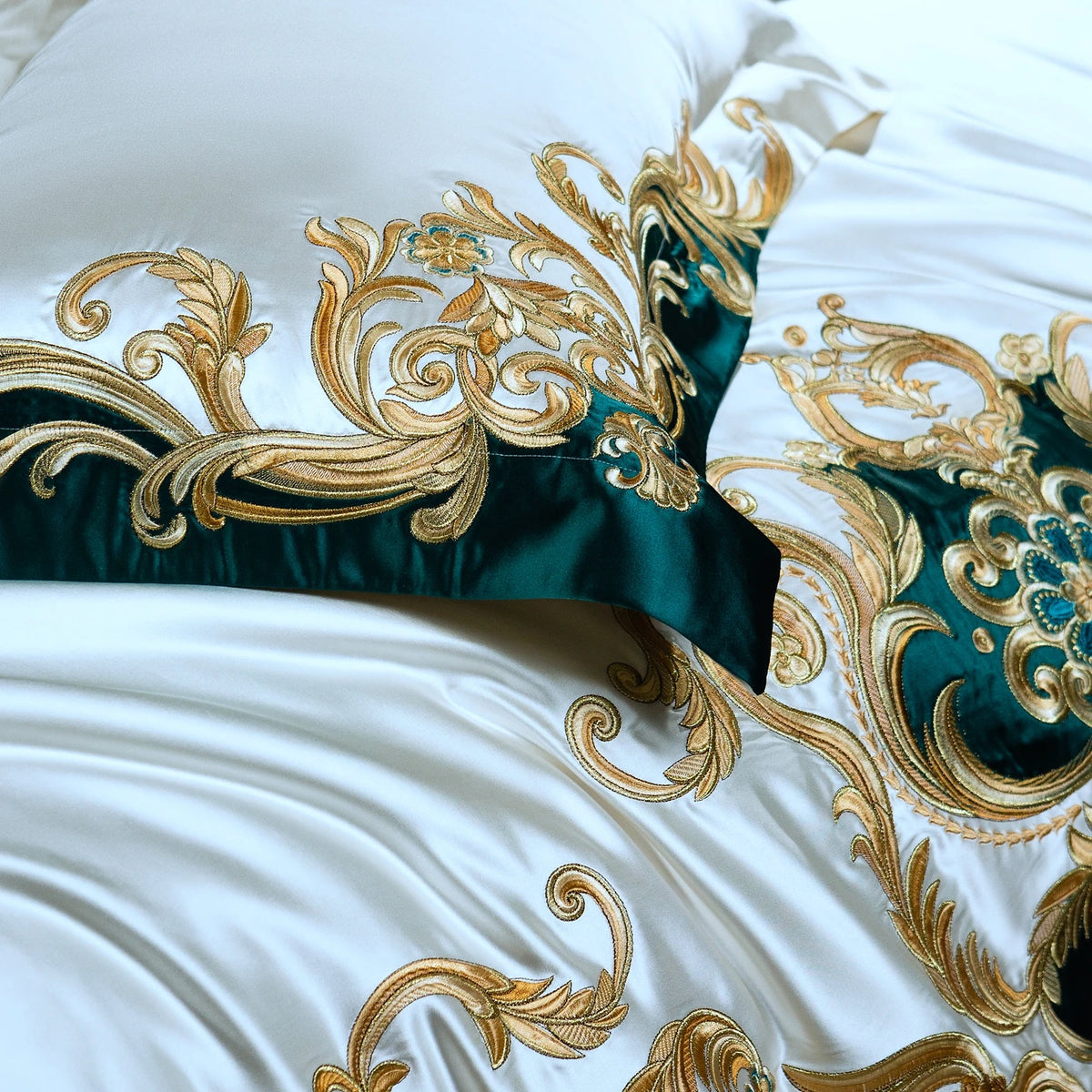 Detail of the gold embroidery and teal border on a pillowcase