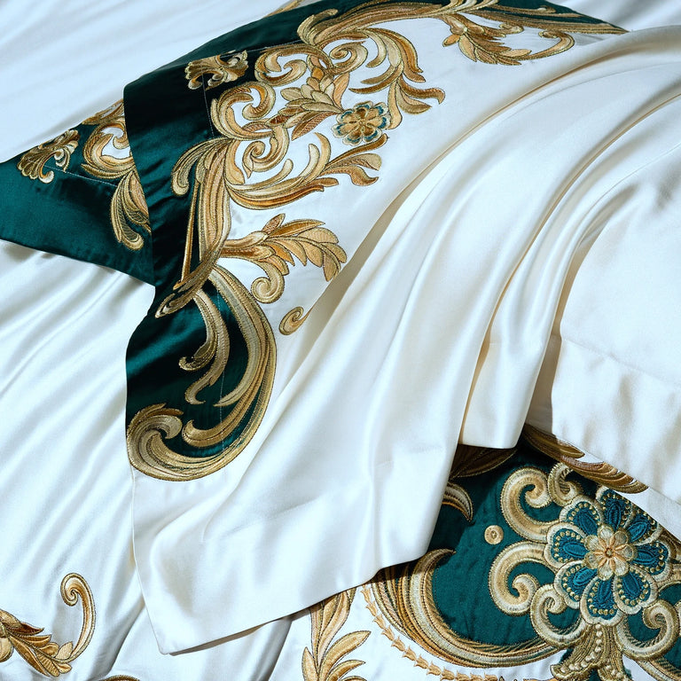 Close up of gold scroll embroidery on the duvet cover