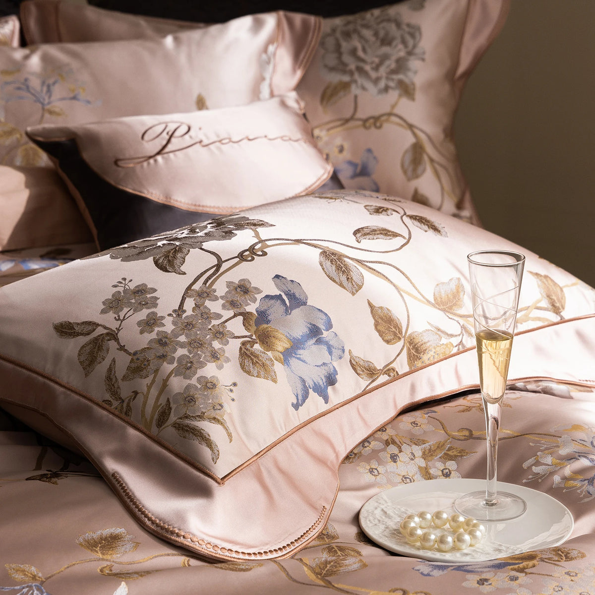 Close up of a pillowcase with flower embroidery and a finished edge