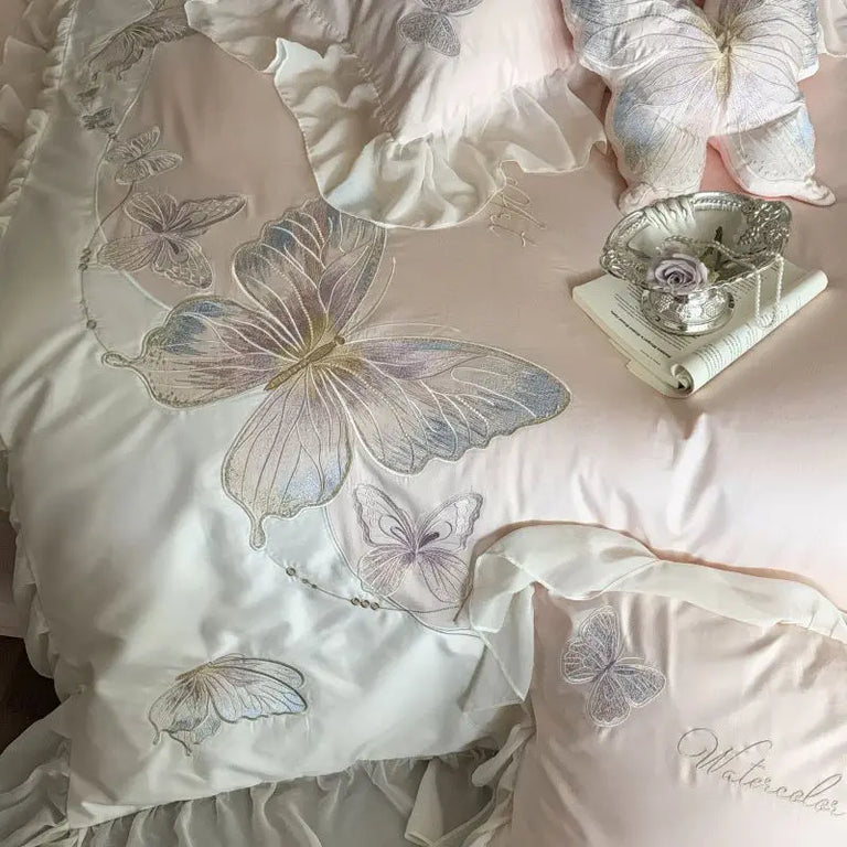 Close up of the butterfly embroidery and sheer ruffle