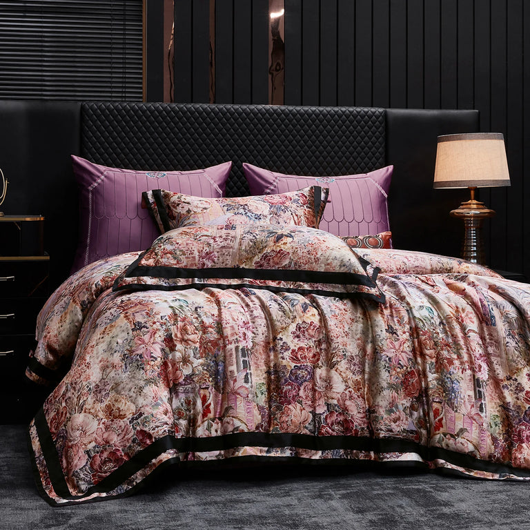 Floral duvet cover and pillowcases with plum cushions