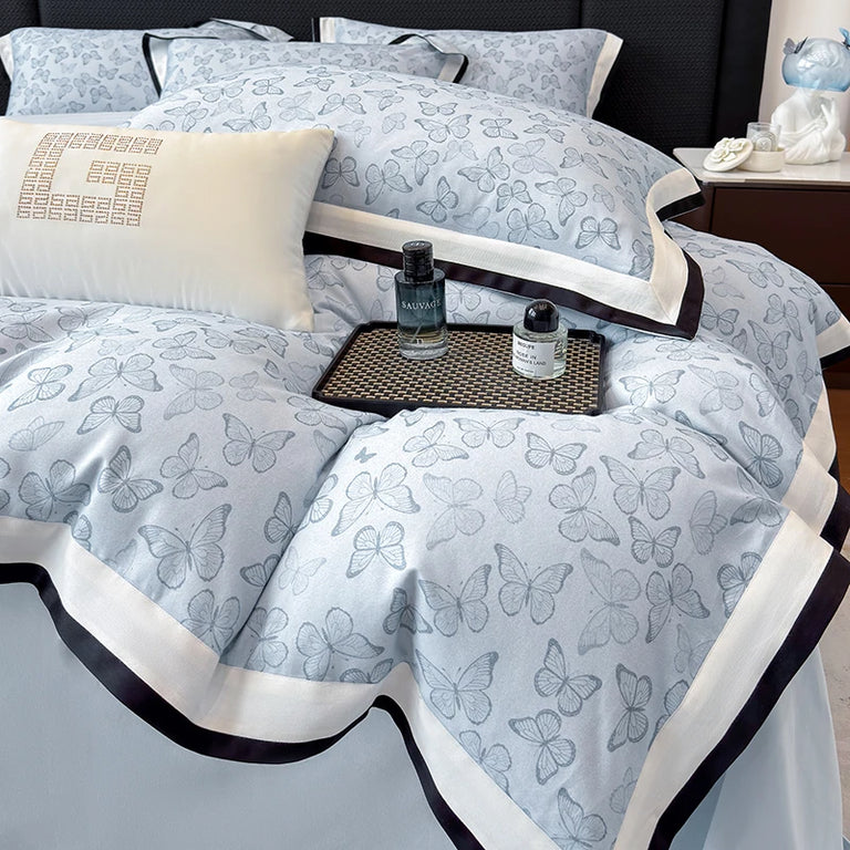 Butterfly print duvet cover and pillowcases styled in a bedroom