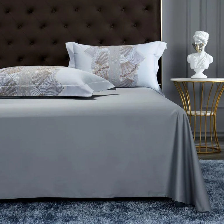 Printed pillowcases with a plain grey flat sheet