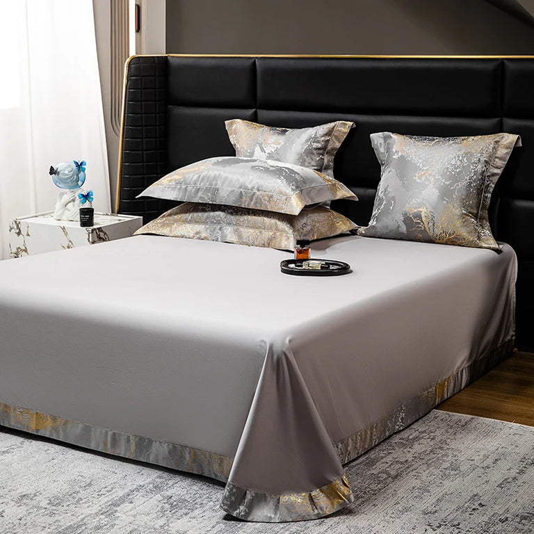 Flat sheet with marble pattern border and matching pillowcases