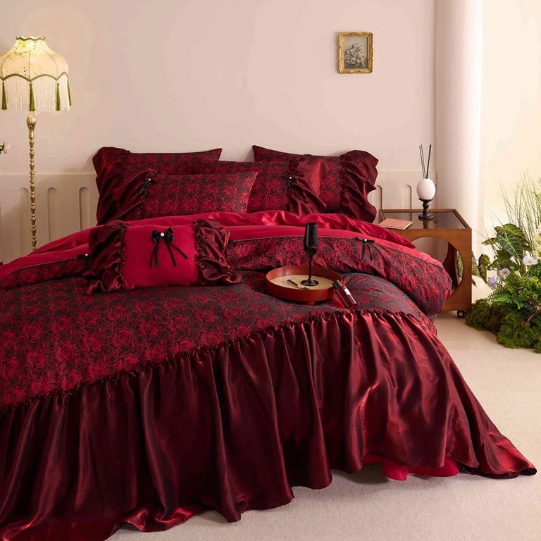 Red satin edge falling over the side of the bed